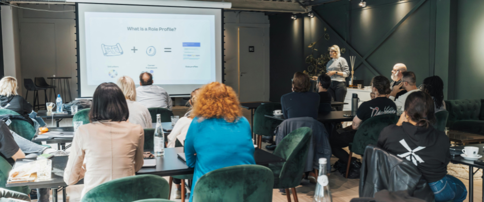 Association professionals attending a professional development workshop, with a presenter and projected screen at the front of the room.